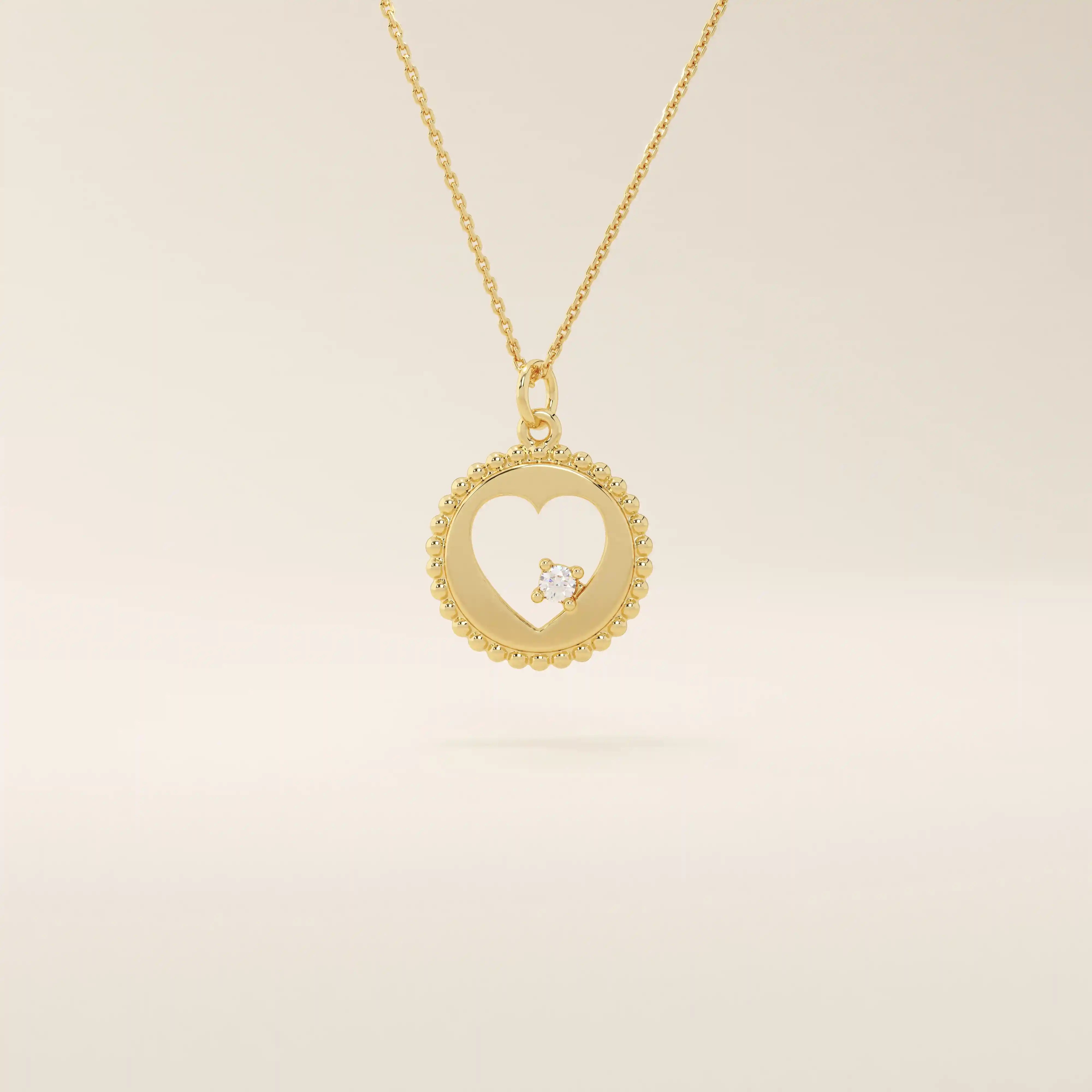 14k solid gold circle pendant necklace featuring a heart-shaped cutout and a single sparkling moissanite. Delicate and meaningful design.
