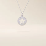 14k solid gold circle pendant necklace featuring a star-shaped cutout and a single sparkling moissanite. Delicate and celestial-inspired design.