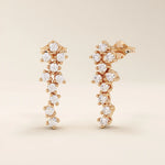 14k solid gold cluster stud earrings with tiny moissanite stones arranged in a soft, organic shape. Delicate and sparkling studs. Ideal for everyday wear or gifting.