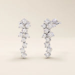 14k solid gold cluster stud earrings with tiny moissanite stones arranged in a soft, organic shape. Delicate and sparkling studs. Ideal for everyday wear or gifting.