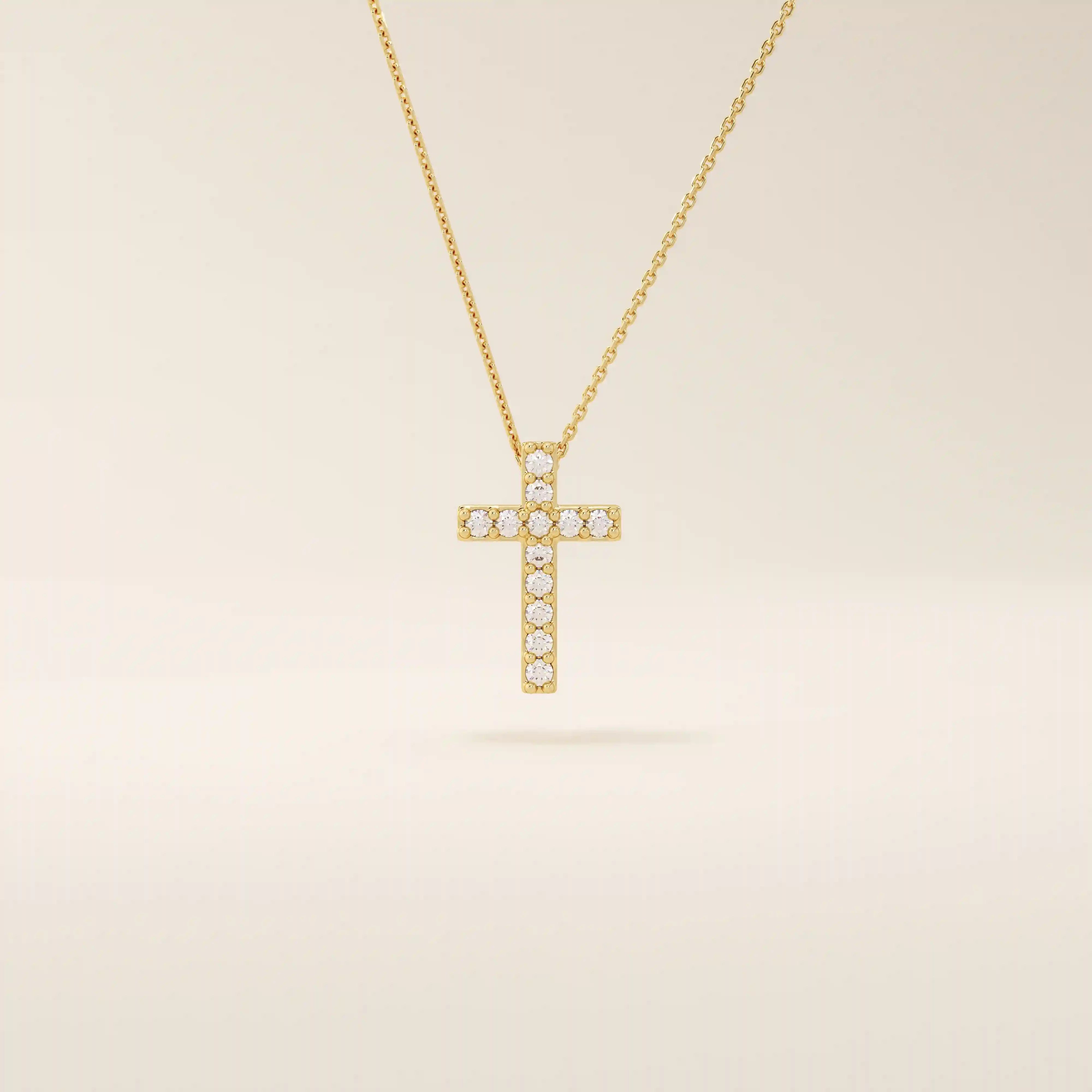 14k solid gold cross necklace with front and back pave moissanite detailing. Reversible and minimalist gold necklace design. Perfect for daily or layered styling.