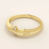 14k solid gold crossover band promise ring accented with tiny sparkling moissanites. Elegant design perfect for everyday wear or gifting.