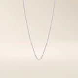 14k solid gold curb chain necklace with flat, closely interlocked links and a polished finish. A timeless and sturdy gold chain. Ideal for everyday wear or layering.