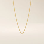 14k solid gold curb chain necklace with flat, closely interlocked links and a polished finish. A timeless and sturdy gold chain. Ideal for everyday wear or layering.