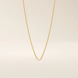 14k solid gold curb chain necklace with flat, closely interlocked links and a polished finish. A timeless and sturdy gold chain. Ideal for everyday wear or layering.