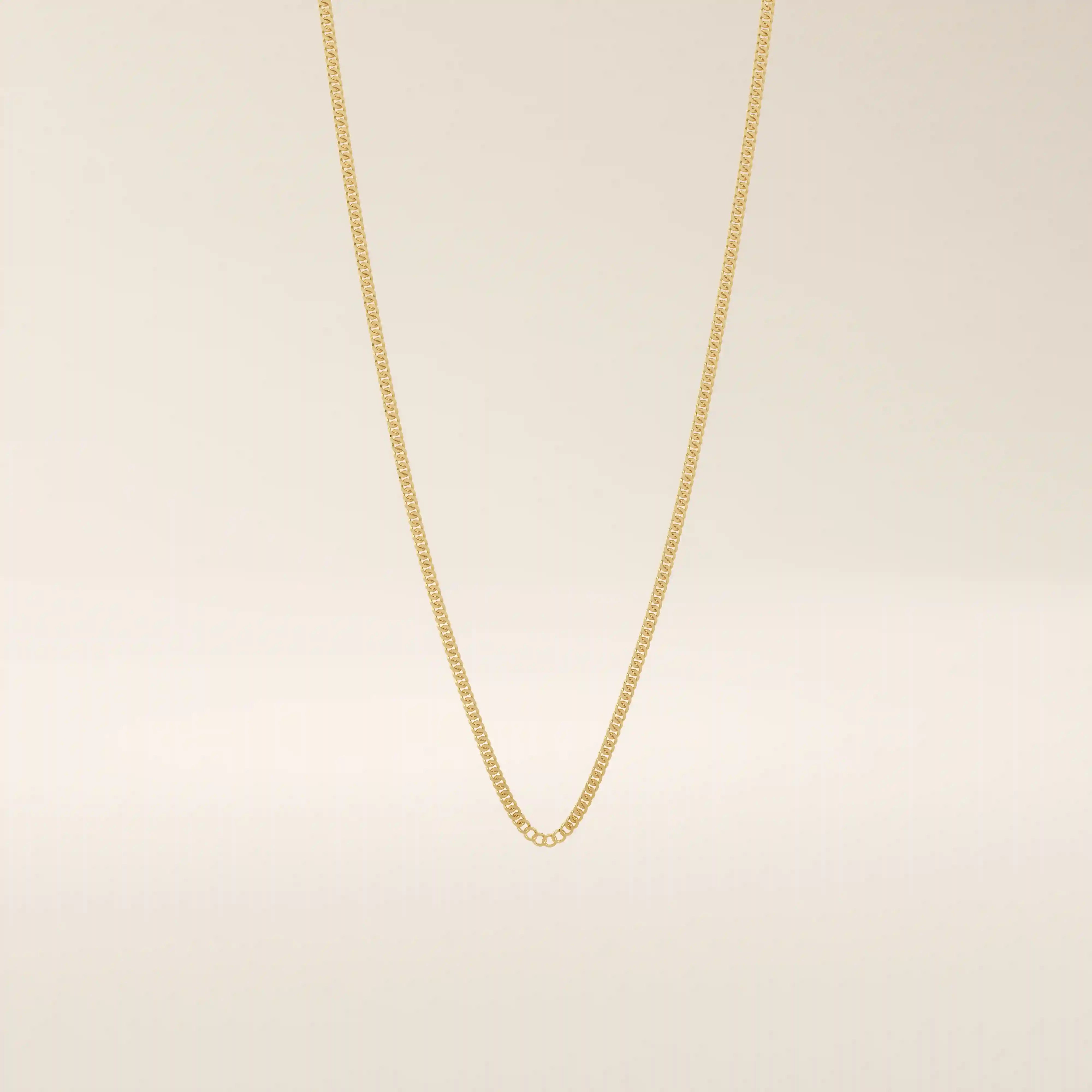 14k solid gold curb chain necklace with flat, closely interlocked links and a polished finish. A timeless and sturdy gold chain. Ideal for everyday wear or layering.