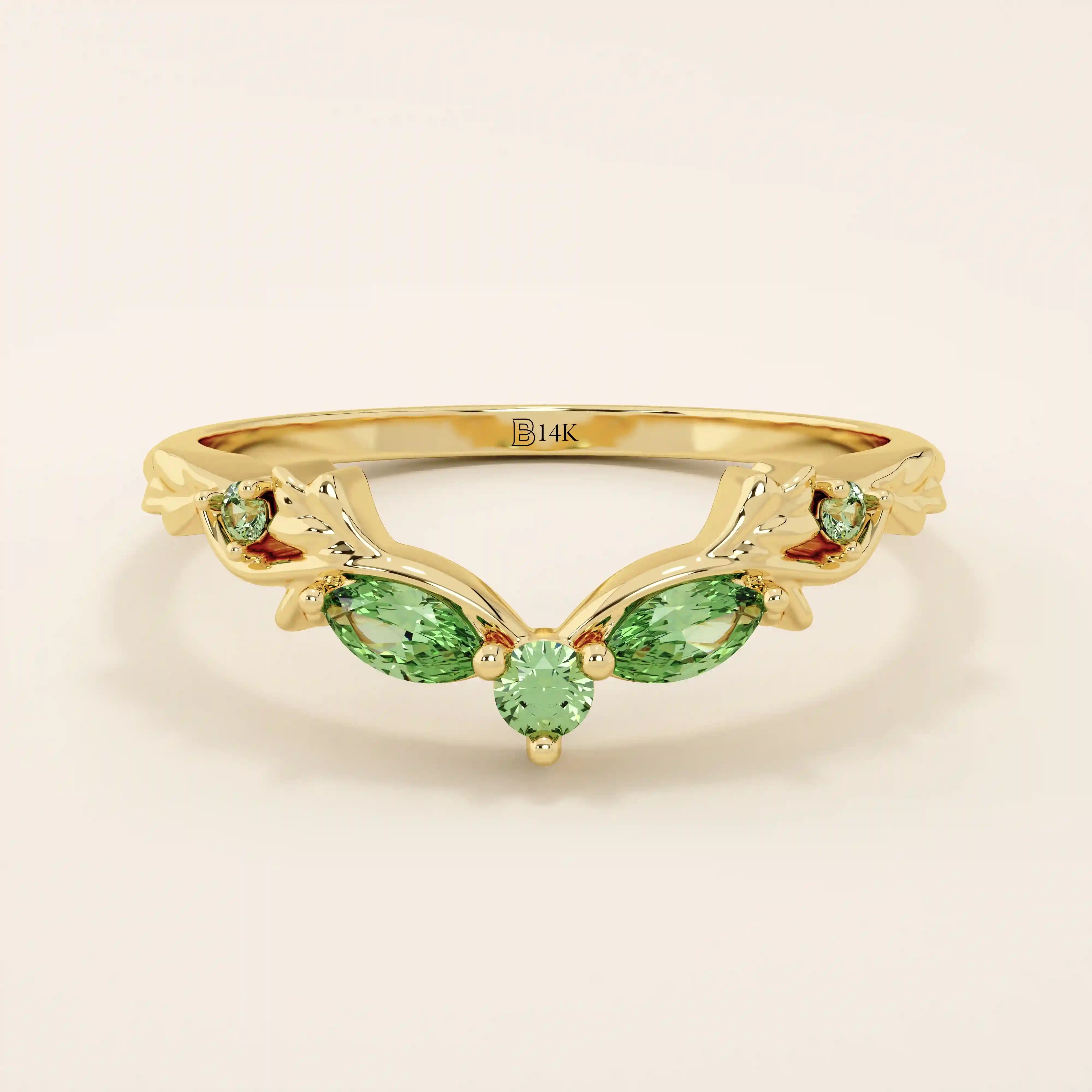 14k solid gold curve nesting ring featuring a marquise-cut emerald gemstone. Elegant and modern stacking design for women.
