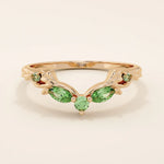 14k solid gold curve nesting ring featuring a marquise-cut emerald gemstone. Elegant and modern stacking design for women.