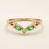 14k solid gold curve nesting ring featuring a marquise-cut emerald gemstone. Elegant and modern stacking design for women.