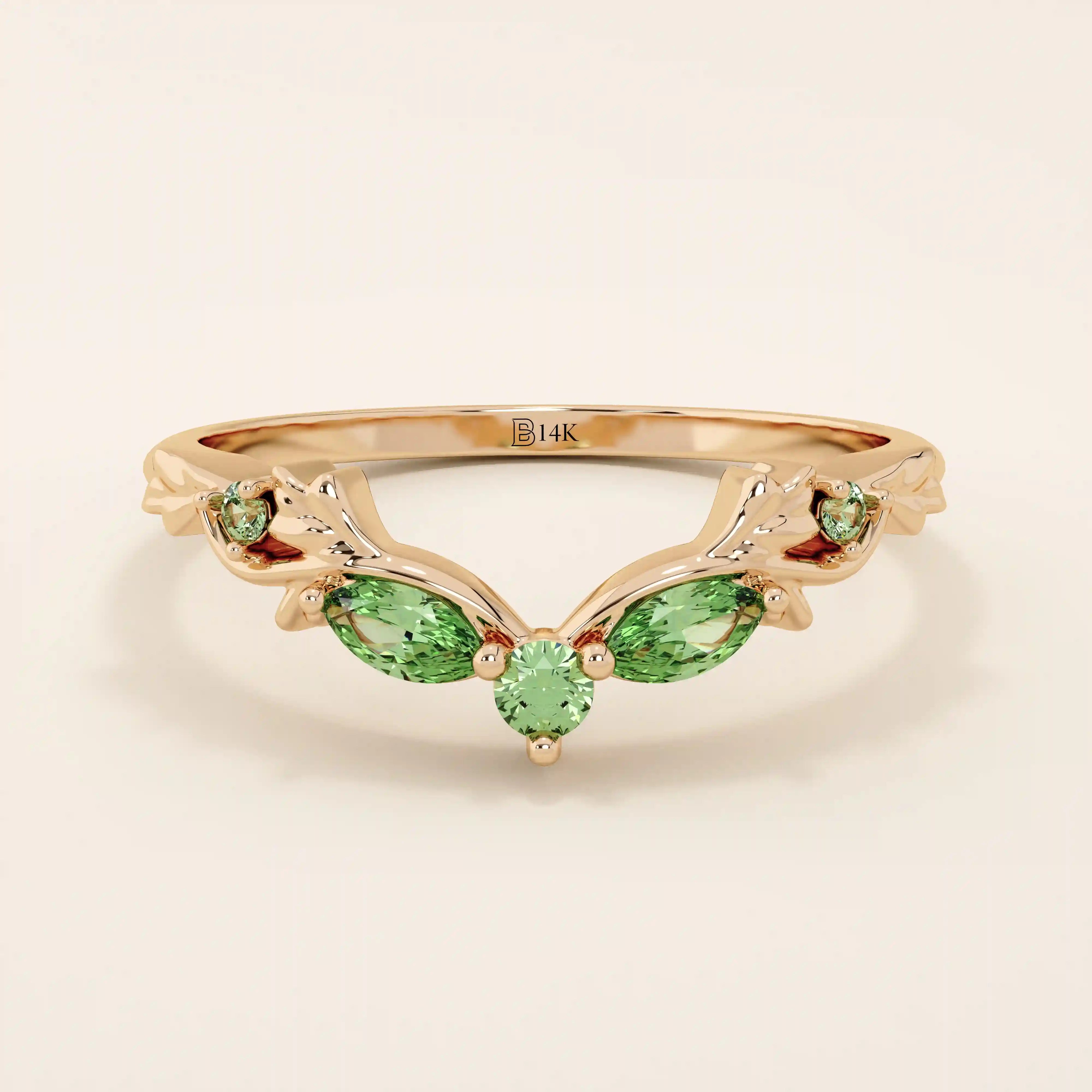 14k solid gold curve nesting ring featuring a marquise-cut emerald gemstone. Elegant and modern stacking design for women.