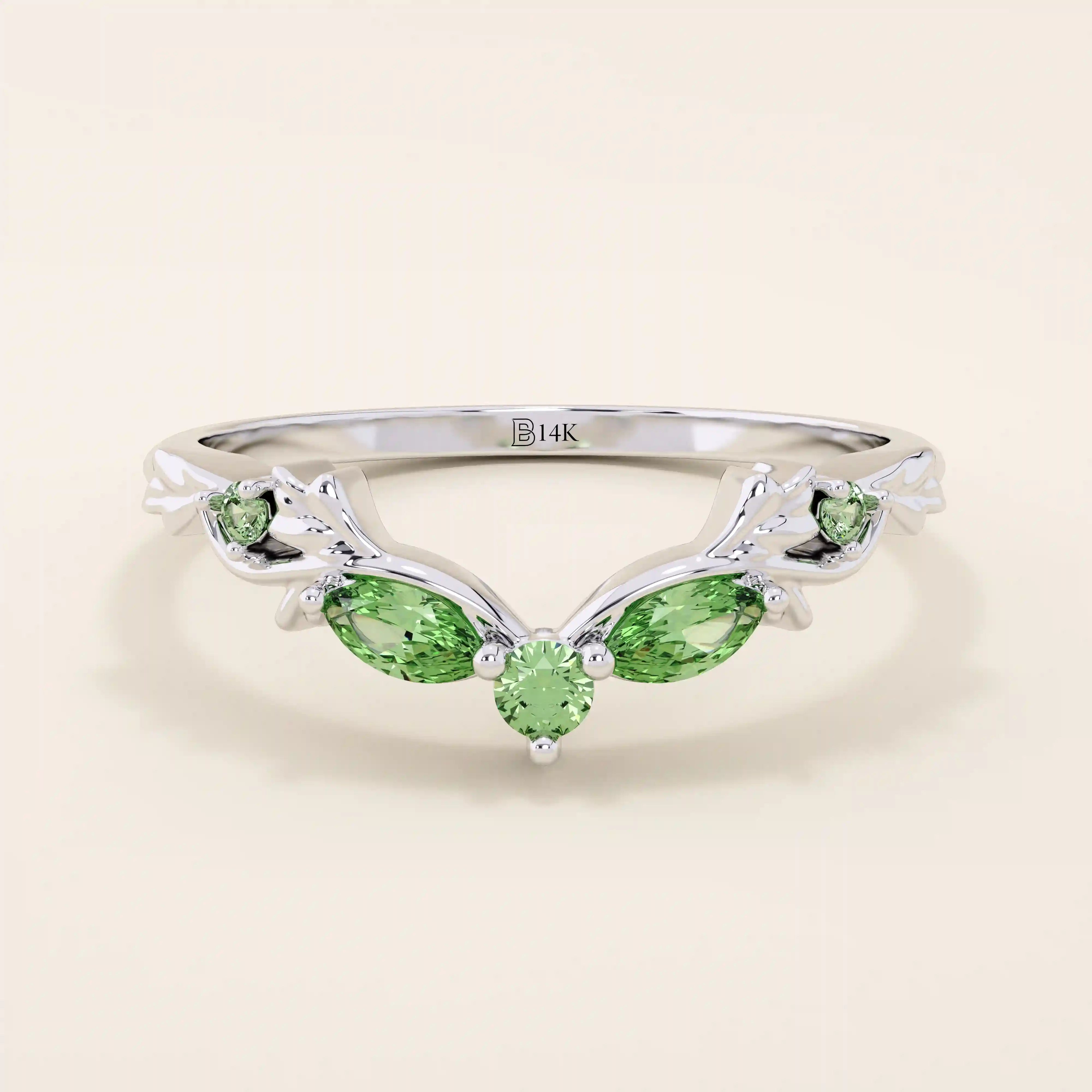 14k solid gold curve nesting ring featuring a marquise-cut emerald gemstone. Elegant and modern stacking design for women.