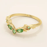 14k solid gold curve nesting ring featuring a marquise-cut emerald gemstone. Elegant and modern stacking design for women.