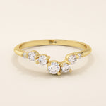 14k solid gold curved nesting ring featuring a cluster of sparkling moissanites. A delicate and elegant stacking ring with organic design.