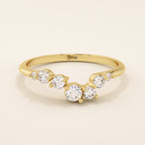14k solid gold curved nesting ring featuring a cluster of sparkling moissanites. A delicate and elegant stacking ring with organic design.