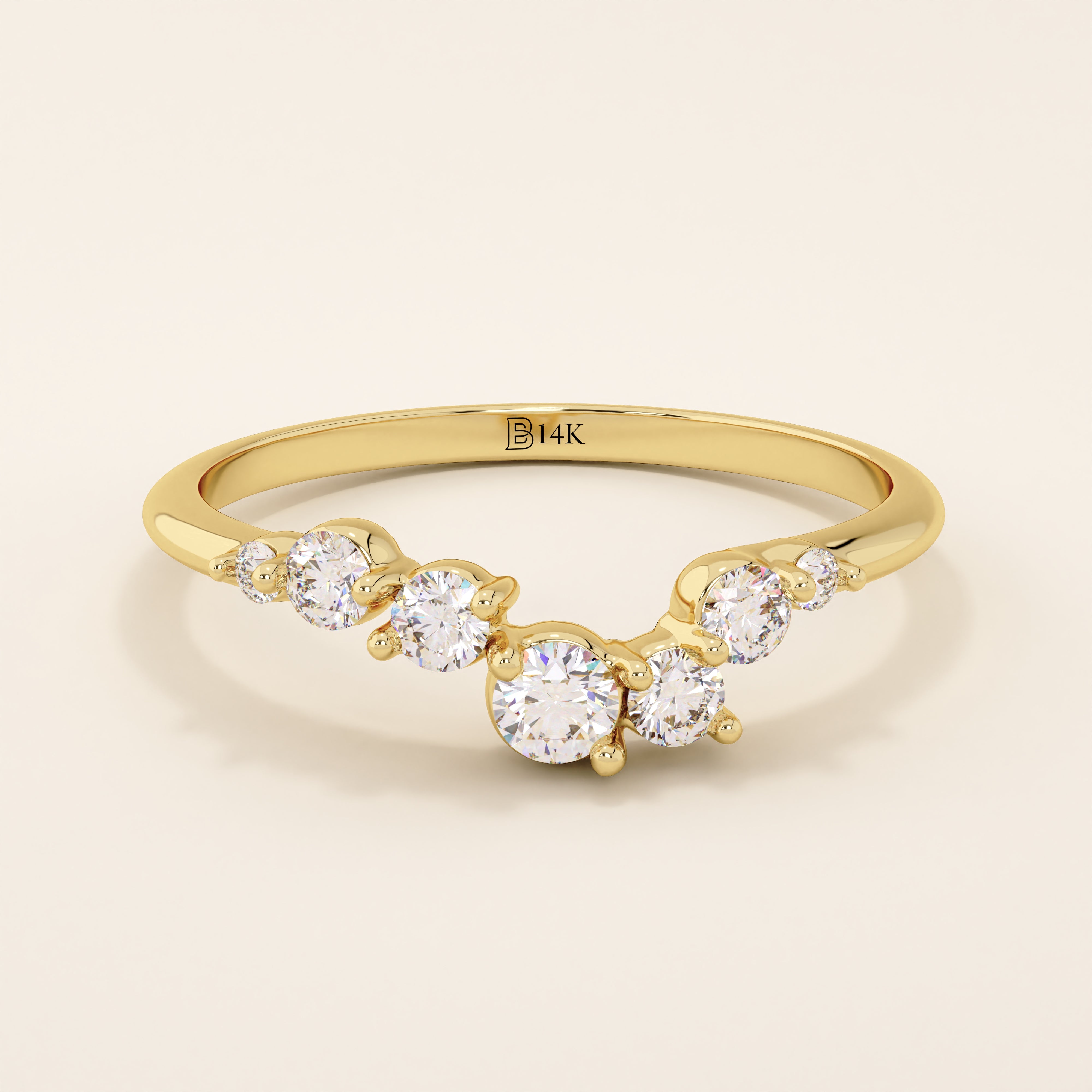 14k solid gold curved nesting ring featuring a cluster of sparkling moissanites. A delicate and elegant stacking ring with organic design.