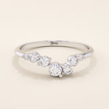 14k solid gold curved nesting ring featuring a cluster of sparkling moissanites. A delicate and elegant stacking ring with organic design.