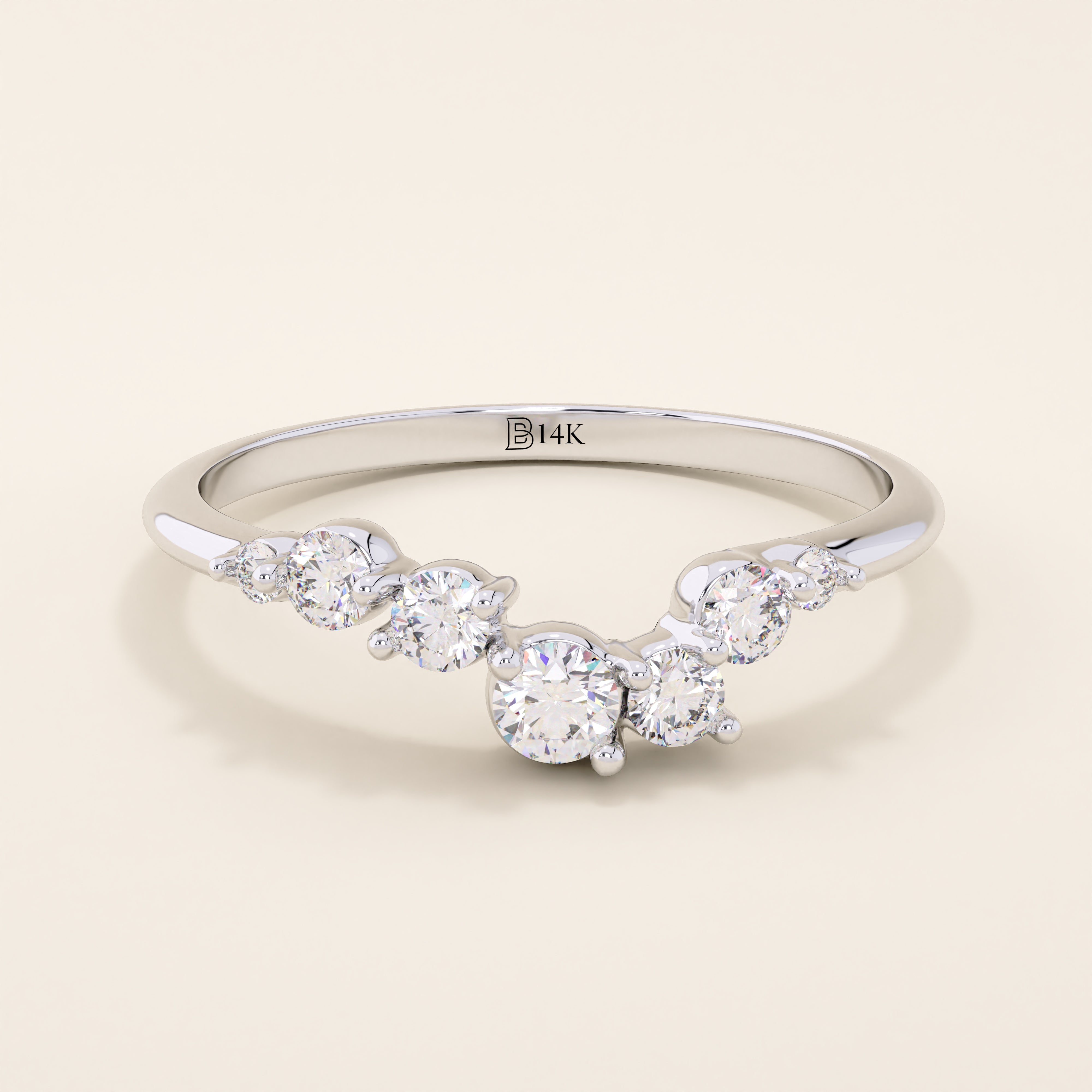 14k solid gold curved nesting ring featuring a cluster of sparkling moissanites. A delicate and elegant stacking ring with organic design.