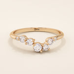 14k solid gold curved nesting ring featuring a cluster of sparkling moissanites. A delicate and elegant stacking ring with organic design.