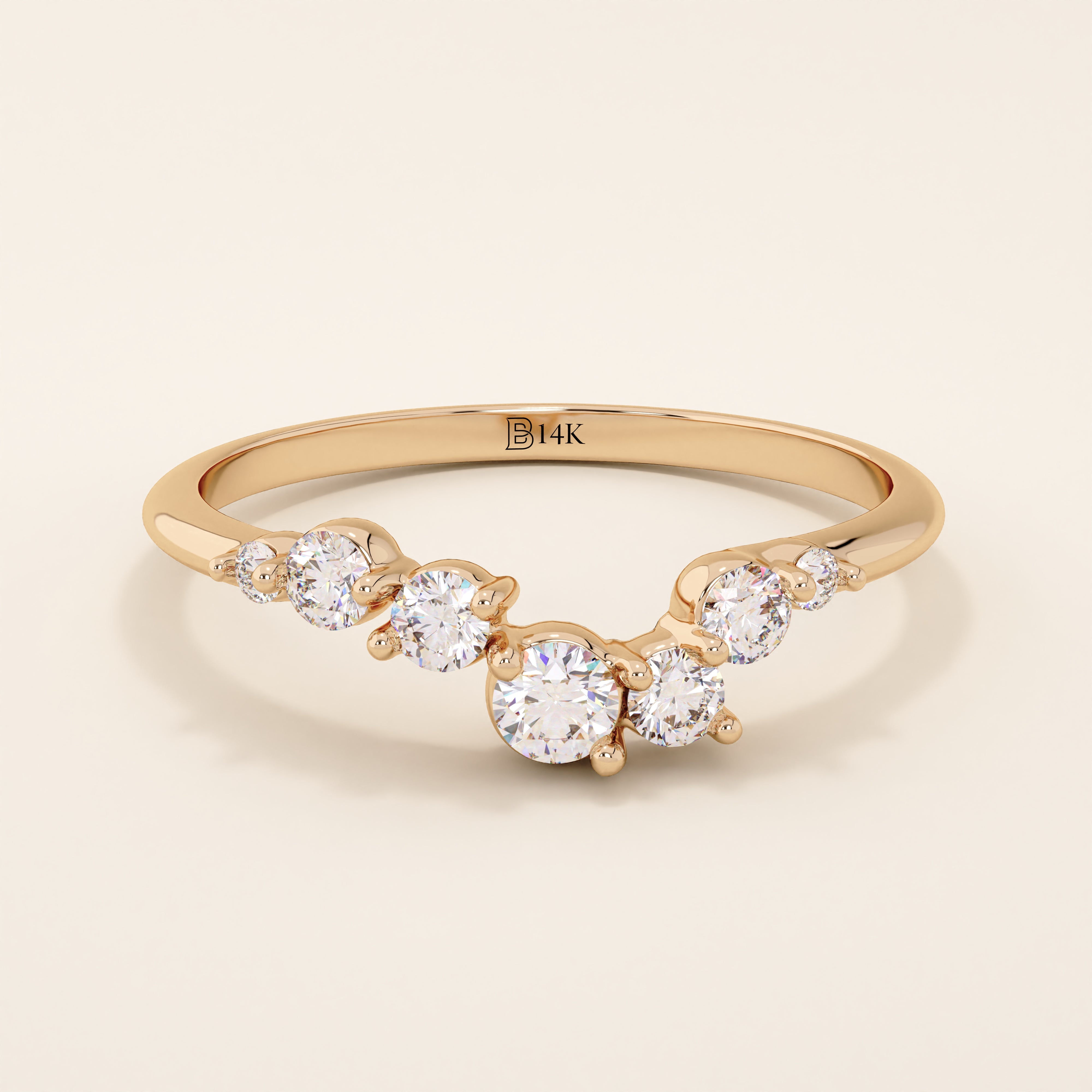 14k solid gold curved nesting ring featuring a cluster of sparkling moissanites. A delicate and elegant stacking ring with organic design.