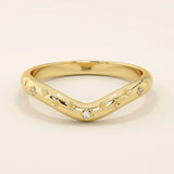 14k solid gold curved nesting ring featuring pavé moissanite star motifs. A celestial-inspired design perfect for stacking with engagement rings.