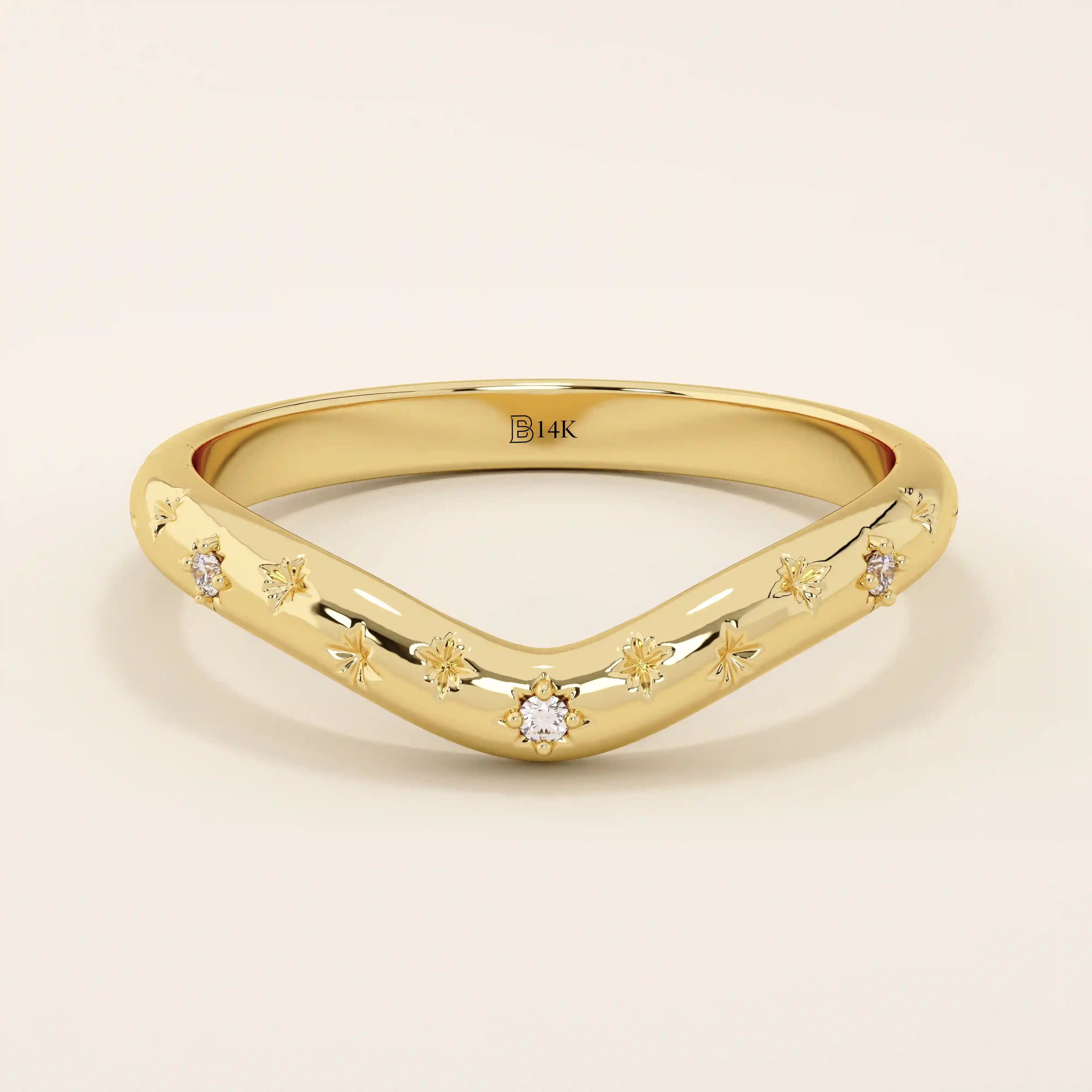 14k solid gold curved nesting ring featuring pavé moissanite star motifs. A celestial-inspired design perfect for stacking with engagement rings.