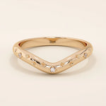 14k solid gold curved nesting ring featuring pavé moissanite star motifs. A celestial-inspired design perfect for stacking with engagement rings.