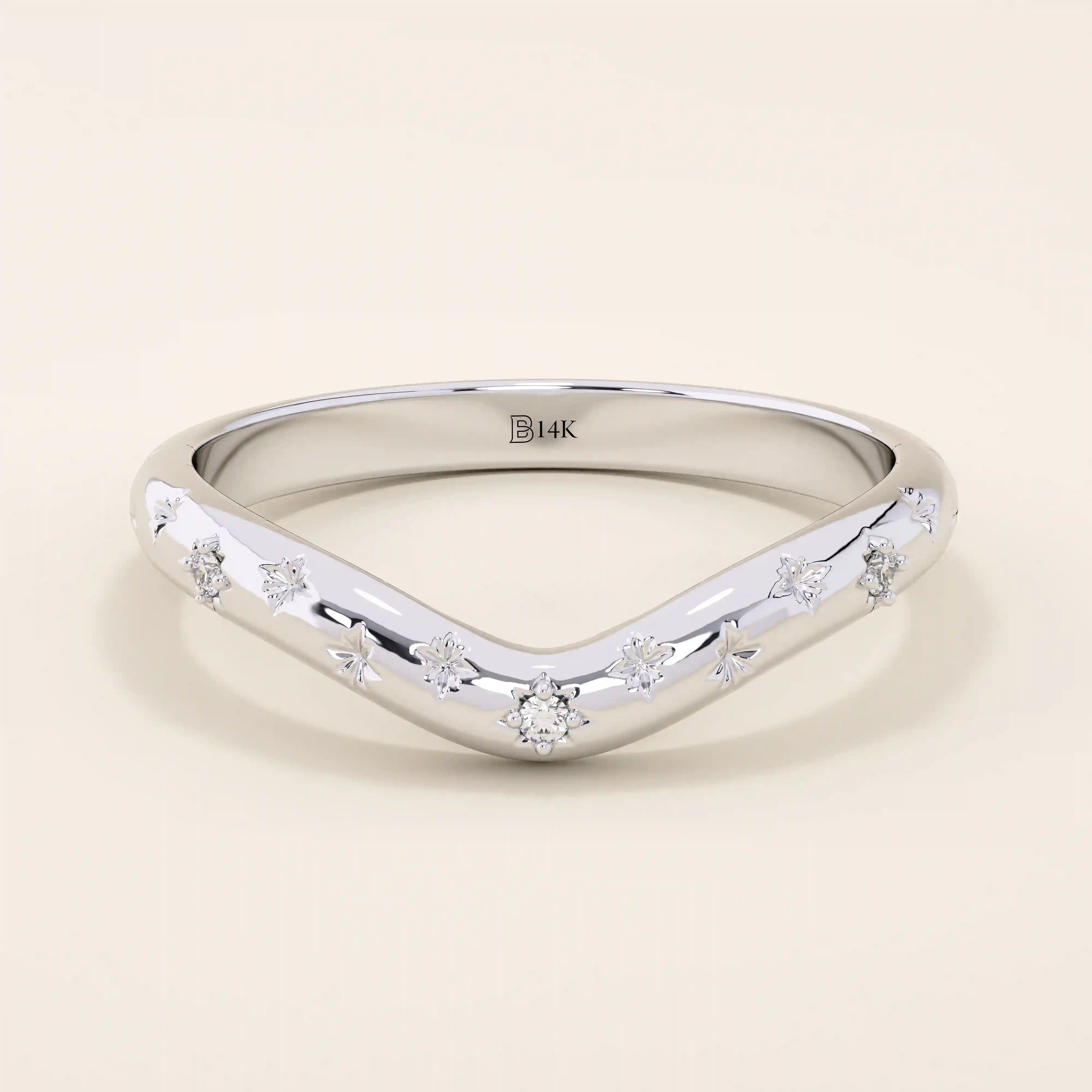 14k solid gold curved nesting ring featuring pavé moissanite star motifs. A celestial-inspired design perfect for stacking with engagement rings.