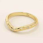 14k solid gold curved nesting ring featuring pavé moissanite star motifs. A celestial-inspired design perfect for stacking with engagement rings.