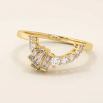 14k solid gold curved ring with a clean arch shape, set with baguette-cut moissanite stones. A refined stacking or nesting band with modern flair.