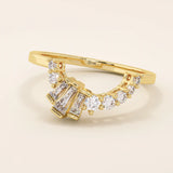 14k solid gold curved ring with a clean arch shape, set with baguette-cut moissanite stones. A refined stacking or nesting band with modern flair.
