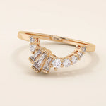 14k solid gold curved ring with a clean arch shape, set with baguette-cut moissanite stones. A refined stacking or nesting band with modern flair.