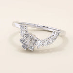 14k solid gold curved ring with a clean arch shape, set with baguette-cut moissanite stones. A refined stacking or nesting band with modern flair.