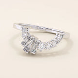 14k solid gold curved ring with a clean arch shape, set with baguette-cut moissanite stones. A refined stacking or nesting band with modern flair.