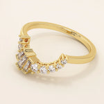 14k solid gold curved ring with a clean arch shape, set with baguette-cut moissanite stones. A refined stacking or nesting band with modern flair.