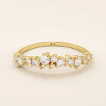 14k solid gold curved stackable wedding ring with cluster-pave moissanites. Minimalist yet sparkling design, perfect for stacking or as a wedding band.
