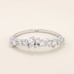 14k solid gold curved stackable wedding ring with cluster-pave moissanites. Minimalist yet sparkling design, perfect for stacking or as a wedding band.