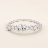 14k solid gold curved stackable wedding ring with cluster-pave moissanites. Minimalist yet sparkling design, perfect for stacking or as a wedding band.