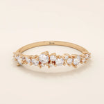 14k solid gold curved stackable wedding ring with cluster-pave moissanites. Minimalist yet sparkling design, perfect for stacking or as a wedding band.