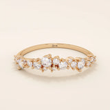 14k solid gold curved stackable wedding ring with cluster-pave moissanites. Minimalist yet sparkling design, perfect for stacking or as a wedding band.