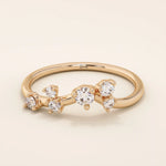 14k solid gold curved stacking ring with scattered moissanite accents. Designed to nest perfectly with solitaires or wear solo with sparkle.