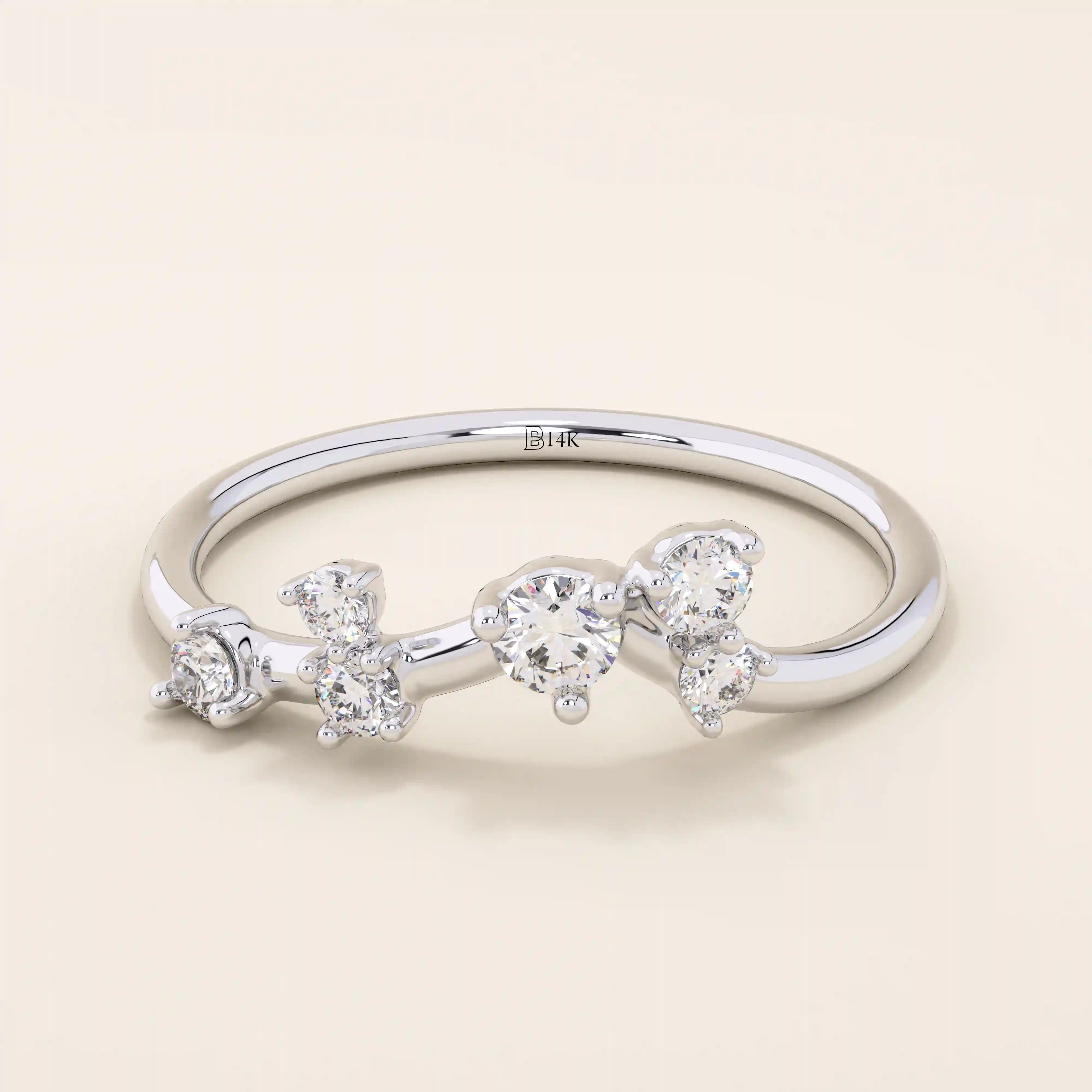 14k solid gold curved stacking ring with scattered moissanite accents. Designed to nest perfectly with solitaires or wear solo with sparkle.
