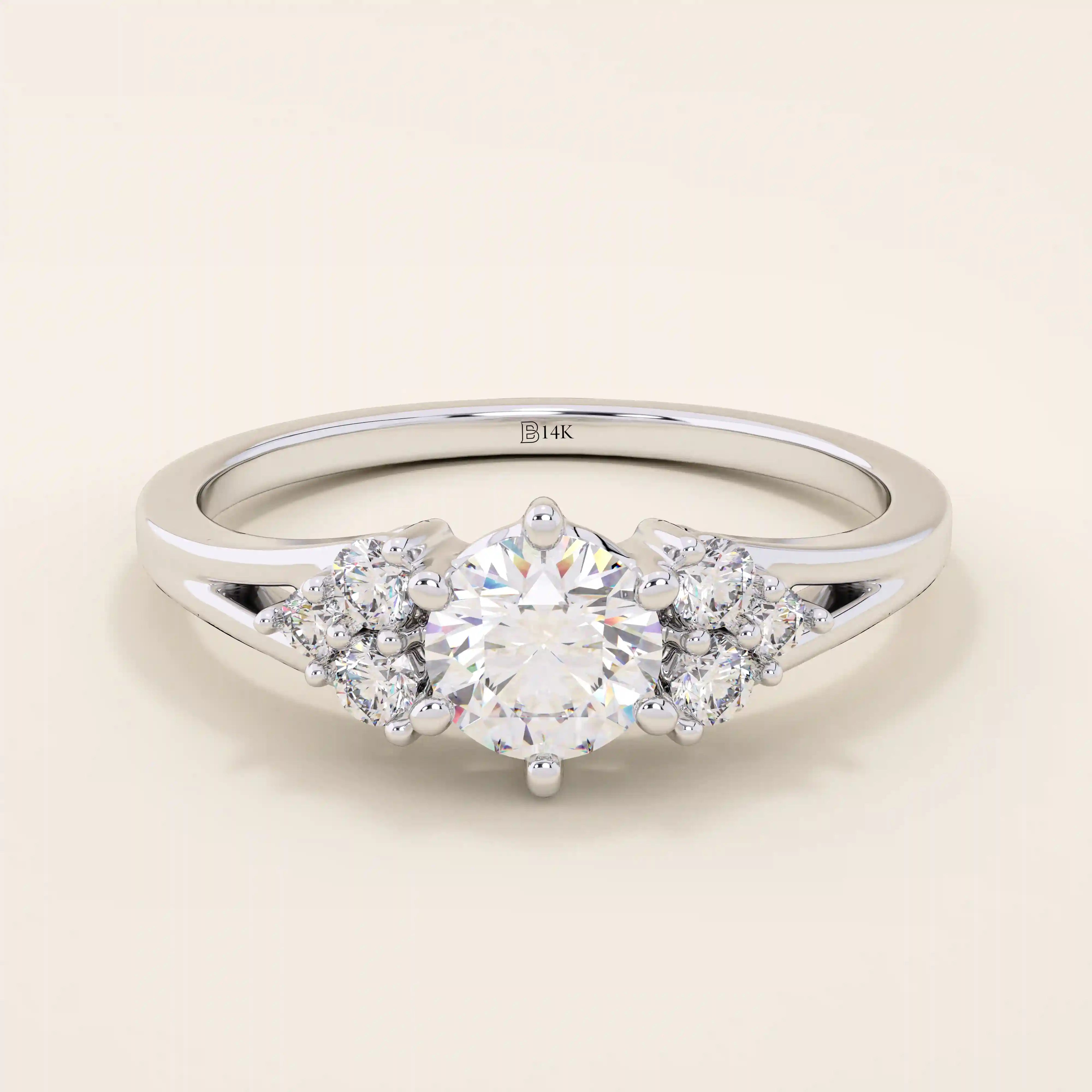 14k solid gold dainty engagement ring with a round moissanite center stone and tiny accent stones on the side. A delicate and timeless design. Perfect for minimal yet meaningful proposals.
