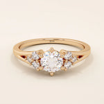14k solid gold dainty engagement ring with a round moissanite center stone and tiny accent stones on the side. A delicate and timeless design. Perfect for minimal yet meaningful proposals.