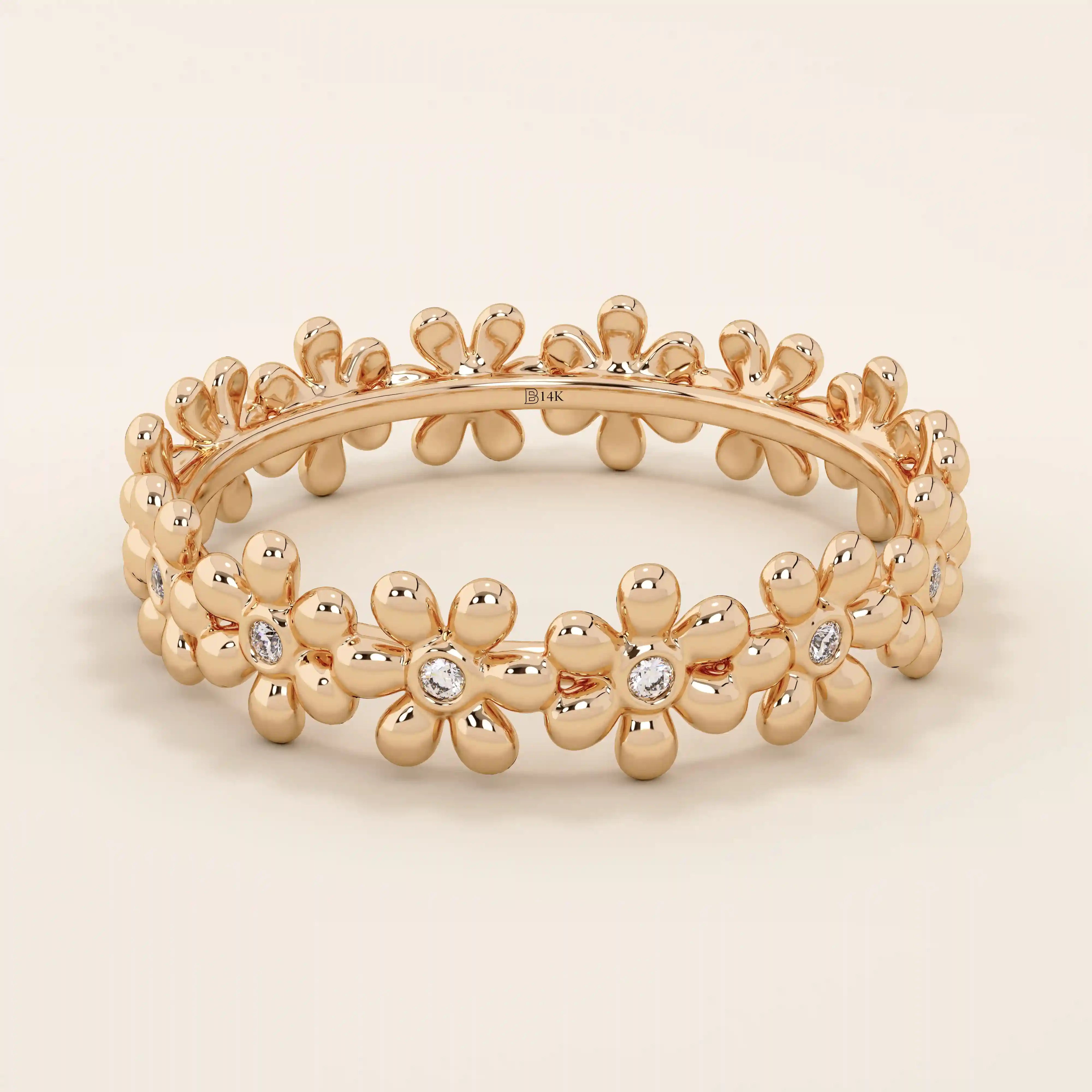 14k solid gold eternity band ring adorned with tiny daisy flower motifs. Delicate and whimsical statement jewelry for women.