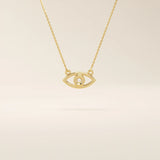 14k solid gold evil eye necklace with a minimalist eye shape and smooth polished finish. A protective and meaningful gold piece. Perfect for everyday wear or gifting.