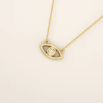14k solid gold evil eye necklace with a minimalist eye shape and smooth polished finish. A protective and meaningful gold piece. Perfect for everyday wear or gifting.BRENNMORE 