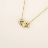 14k solid gold evil eye necklace with a minimalist eye shape and smooth polished finish. A protective and meaningful gold piece. Perfect for everyday wear or gifting.BRENNMORE 
