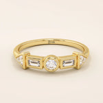 14k solid gold half eternity statement ring featuring bezel-set mixed cut moissanite stones. Modern and elegant design.