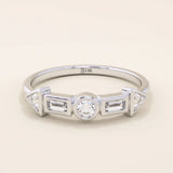 14k solid gold half eternity statement ring featuring bezel-set mixed cut moissanite stones. Modern and elegant design.