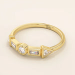 14k solid gold half eternity statement ring featuring bezel-set mixed cut moissanite stones. Modern and elegant design.